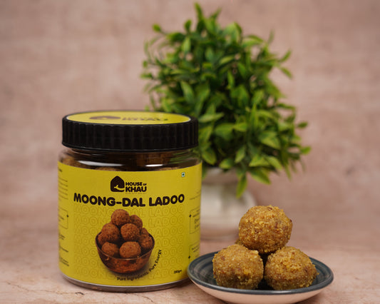 Jar of Moong Dal Ladoo with ladoo balls